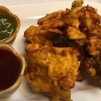 Vegetable Pakora · Vegan. Savory vegetable fritters, mildly spiced, dipped in batter and deep fried.