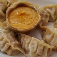 Chicken MoMo (8 Pc) · Minced chicken marinated in home-made spices, stuffed in flour wrap and steamed to perfectio...