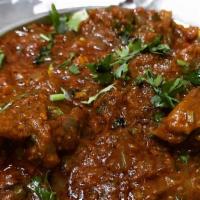 Goat Curry · Meat with bone simmered in traditional spices and flavored Nepalese home-made sauce.