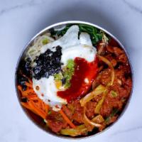 Bi Bim Bap · Bibimbap is a Korean rice bowl topped with an array of vegetables and meat and served with a...