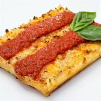 The Vegan Cheese · Violife® vegan “cheese” blend, topped with vegan parmesan and house marinara