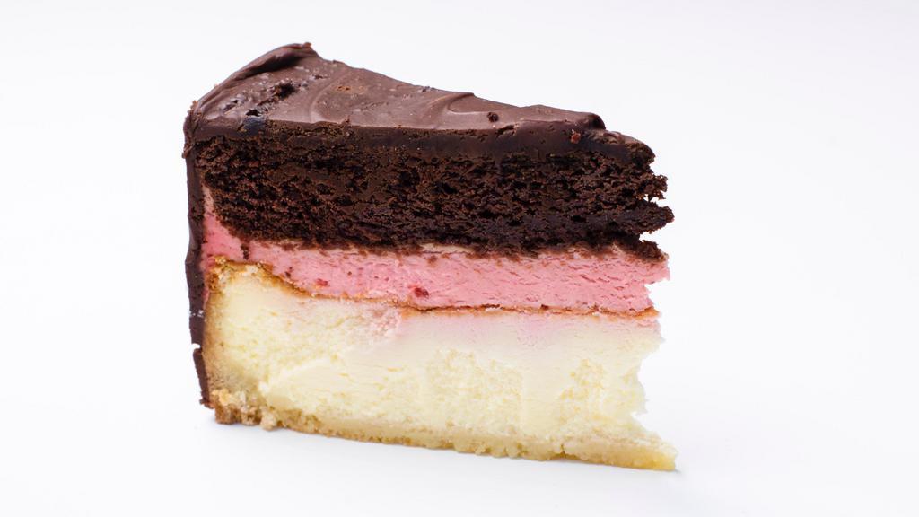 Neapolitan Cheesecake · Deliciously decadent layer cake with original NY Cheesecake, strawberry mousse, and chocolate cheesecake fillings delicately wrapped in shortbread crust.