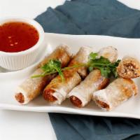 Imperial Rolls · Crispy fried roll filled with ground pork, taro, carrots & silver noodles (4pcs)