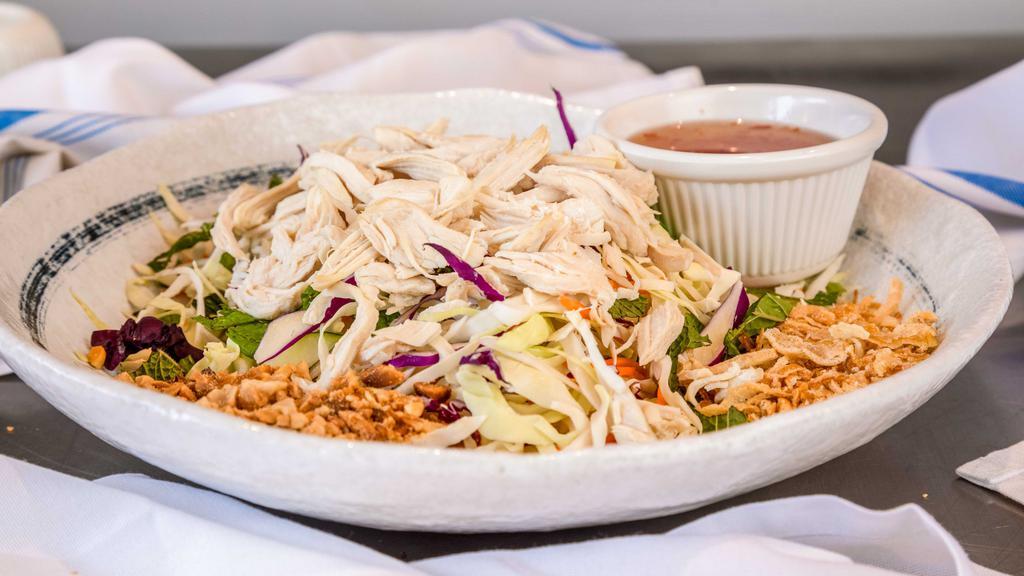 Shredded Chicken Breast Cabbage Salad · Shredded cabbage, carrots, cucumber & mint leaves,
topped with peanuts & fried shallots