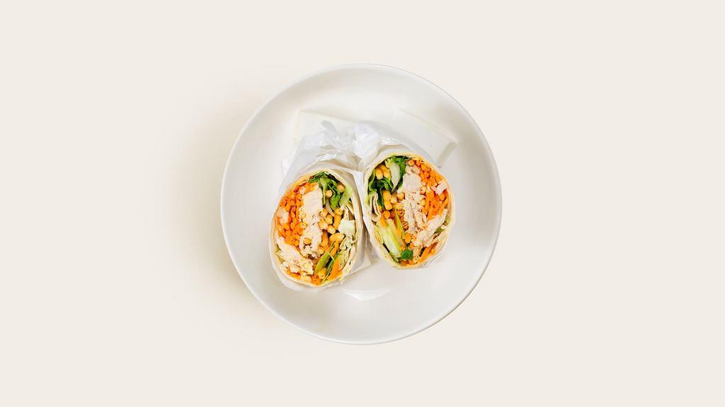 Asian Chicken Wrap · Grilled sliced chicken with shredded cabbage and carrots, chopped romaine, and an Asian sesame vinaigrette in a wrap.