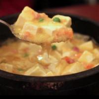 65. Stone Pot Crab Meat Tofu（蟹黄豆腐） · ham and crab meat