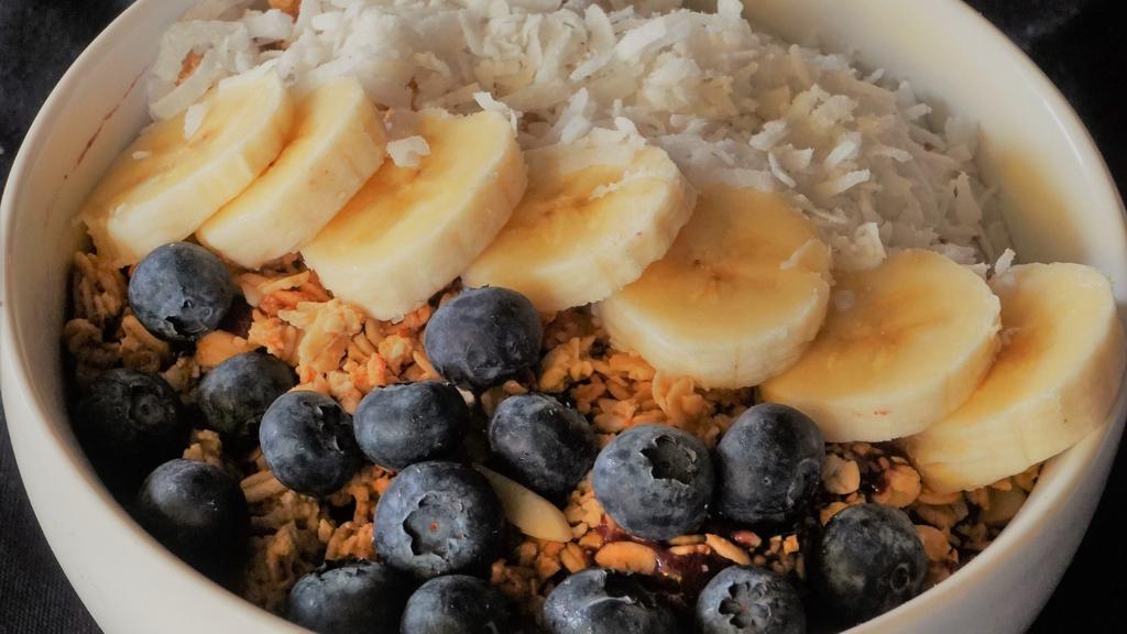 Carmen Miranda Acai Bowl · Organic acaiberry base. 
Topping coconut, blueberries, granolas, bananas. Choose a sauce: peanut butter or honey.