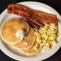 Country 1 · Two bacon, two sausages, two eggs, and three jumbo dollar size pancakes.
