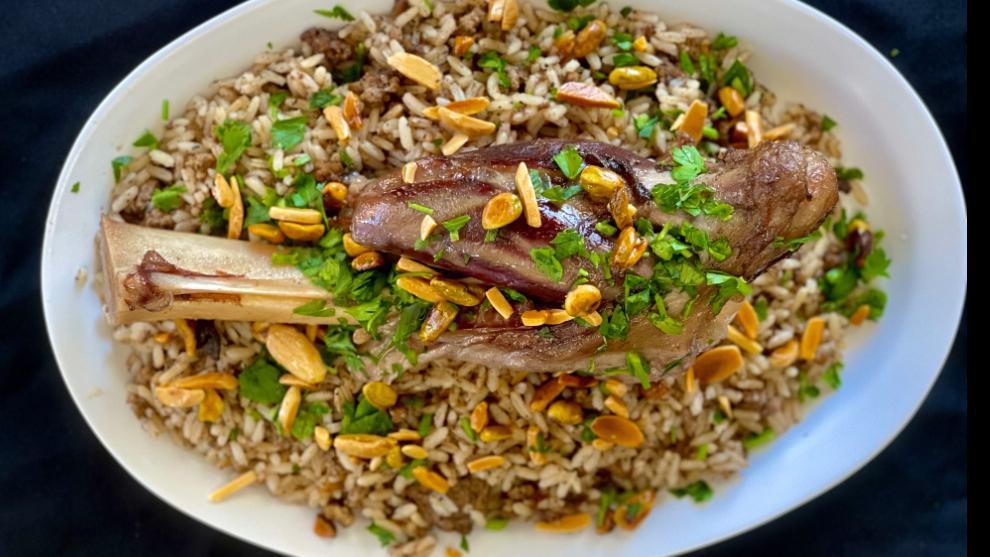 5. Friday - Lamb Shanks · Chef’s favorite ground lamb cooked with rice, seasoned with our special ouza blend spices. Topped with a whole lamb shank. (nuts on top per request).
