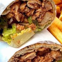 2. Beef Shawarma · Beef sandwich seasoned and marinated with our authentic shawarma spices, smothered with tahi...