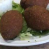 4. Kibbeh (3 Pcs.) · A mixture of ground meat and cracked wheat, stuffed with seasoned meat and onions, cooked to...