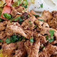 8. Chicken Shawarma · Tender chicken breast thinly sliced, seasoned and marinated with our authentic shawarma spic...