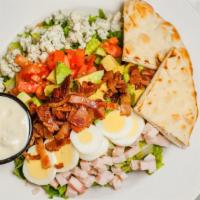 Cobb Salad · Bacon, smoked turkey, egg, tomato, Bleu cheese and avocado over fresh greens. Your choice of...