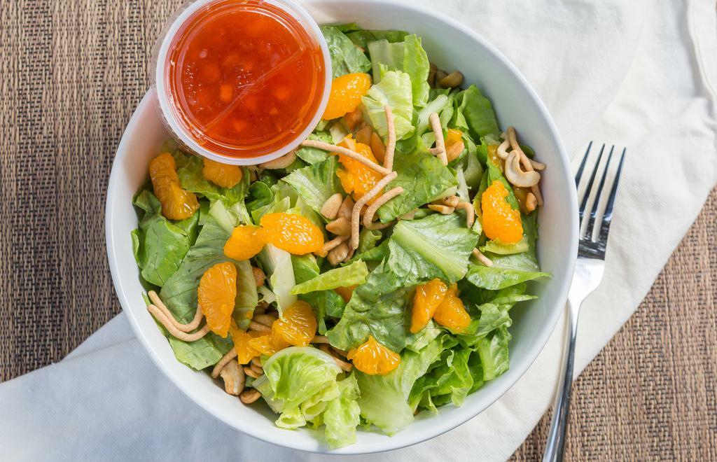 Asian Salad · Teriyaki chicken breast, fresh veggies, water chestnuts and whole cashews, sautéed in our own sweet and sour dressing. Served hot off the grill and piled atop fresh greens, crunchy noodles and Mandarin oranges.