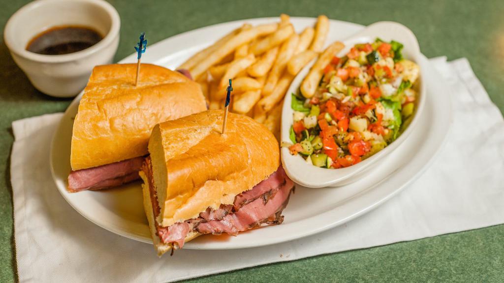 French Dip · Thinly sliced roast beef on a French roll with Monterey Jack cheese. Served with au jus.