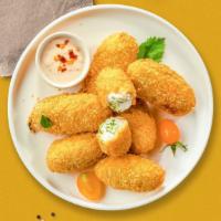 Jalapeno Poppers · Six piece golden deep-fried jalapeños filled with cream cheese.