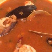 Picante De Mariscos · Sautéed prawns, scallops, baby shrimp, white fish, potato, clams, black mussels sautéed with...