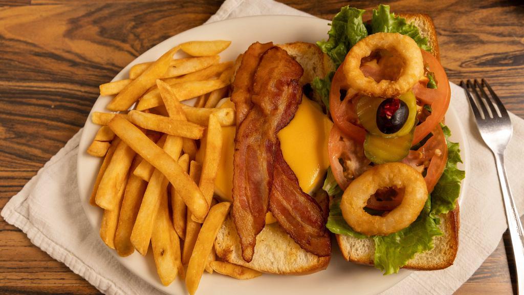 The Flippy Burger · 1/3 lb burger served on a French roll with American cheese, Swiss cheese, bacon, onion rings, lettuce, tomato, & BBQ sauce .