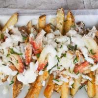 Half Order of Crab Fries · Your choice of Cajun or lemon pepper fries topped with real blue crab meat and drizzled with...