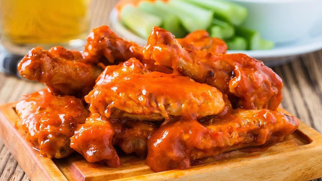 Hot Chicken Wings · Fresh oven-baked chicken wings topped with hot sauce for exotic taste