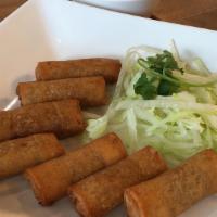 Egg Rolls · Fried rolls, filled with ground pork, shrimp, grated taro, sweet onions, and jicama. Served ...