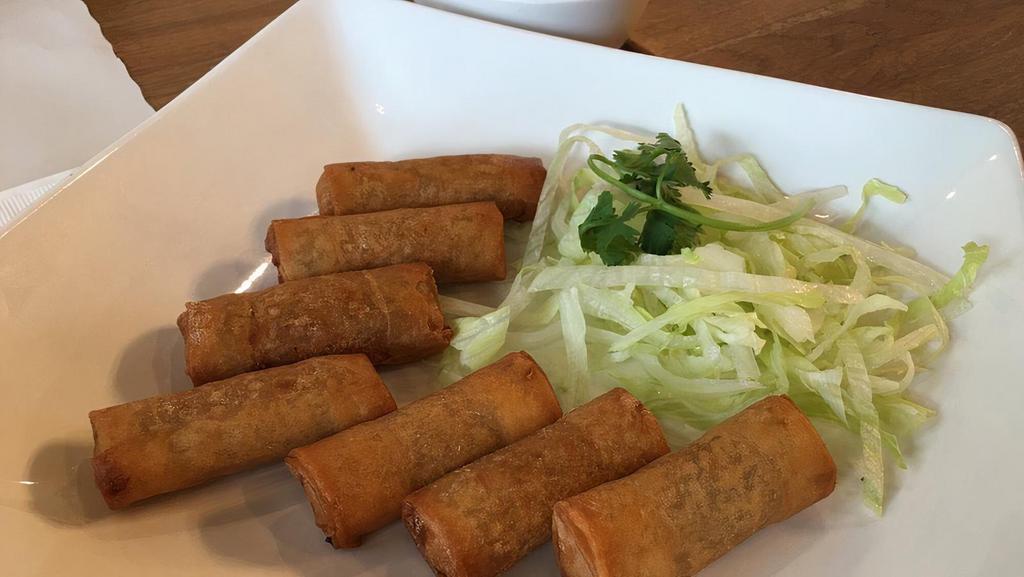 Egg Rolls · Fried rolls, filled with ground pork, shrimp, grated taro, sweet onions, and jicama. Served with fresh herbs and lime-infused fish sauce. Eight pieces.