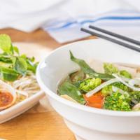 Green Spicy Hue · Thick rice noodles, spicy vegetables broth, tofu, seasonal vegetable, and fresh herbs. Serve...