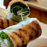 Tofu Rolls · Grilled tofu, thin rice noodle, and fresh herbs. Served with housemade peanut dipping sauce.