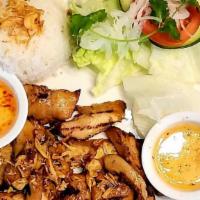 Grilled Pork · House marinated pork roasted to perfection. Served with spring mix lettuce and white rice.