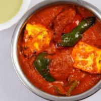 Kadhai Paneer · An iron wok fried cottage cheese cooked with pepper and onion.