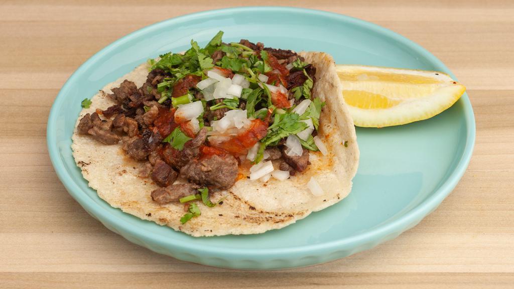 Regular Taco · Cilantro, onion, fresh salsa and choice of meat on a handmade corn tortilla.