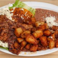 Enchiladas Michoacanas · Four corn tortillas soaked in red sauce, then lightly pan fried and filled with grilled dice...