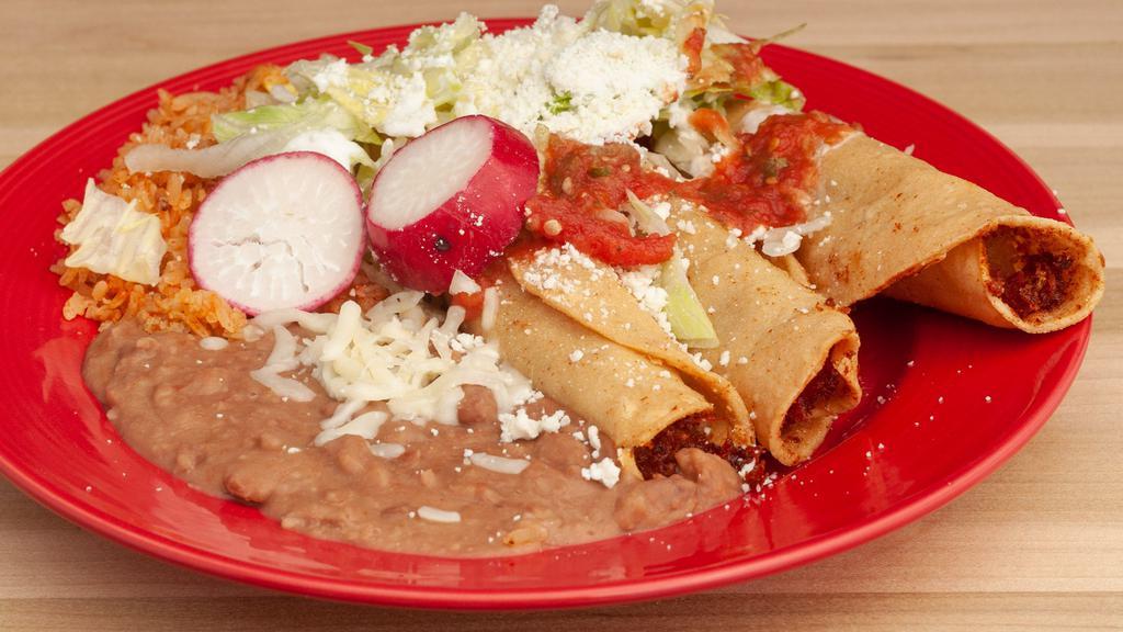 Flautas Plate · Three crispy rolled taquitos, stuffed with your choice of beef, chicken or potatoes. Served with side beans, rice and topped with lettuce, sour cream, salsa and avocado.