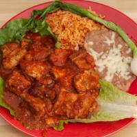Costilla's · Spare pork ribs in our spicy roja. Served with side of rice, beans and two handmade corn tor...