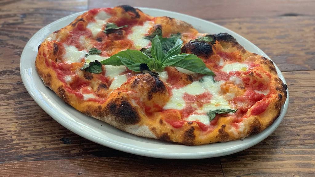 Margherita Pinsa (vegetarian) · Roman style pizza with Tomato sauce, Mozzarella, fresh Basil.