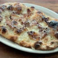Casal Bertone Pinsa · Roman style pizza with mozzarella, guanciale (cured pork jowl), pecorino, chestnut honey