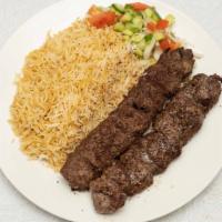 Beef Shami Kabob · Seasoned lean ground beef served with rice, naan (flatbread), and salad.