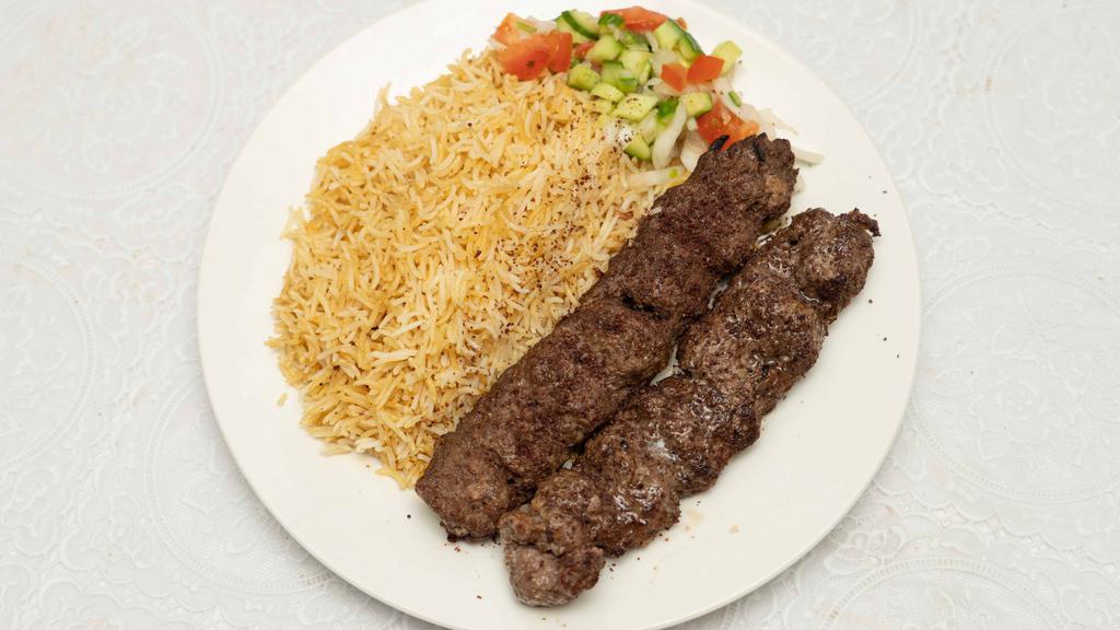 Beef Shami Kabob · Seasoned lean ground beef served with rice, naan (flatbread), and salad.