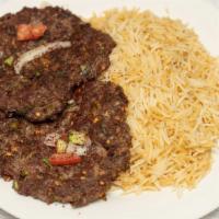 Chaplee Kabob · Ground beef mixed with chopped onions, green pepper, and seasoning served with rice and salad.