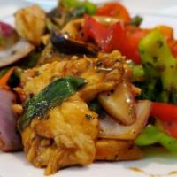E6. Basil Chicken · Bell peppers, onions, broccoli, mushroom, baby com, carrots, basil leaf