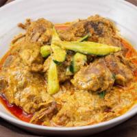 E11. Beef Rendang · Beef shank, mixed curry spices, onions, galangal, chili, cucumbers