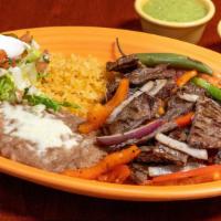 #14 Plato Fajita · Your choice of meat, rice, beans, pepper, onions, tomatoes & tortillas.
