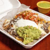 Super Nachos · Corn chips topped with refried beans, melted cheese, fresh salsa, sour cream guacamole and y...