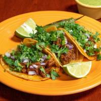 Street Taco · Onions, cilantro, & choice of meat