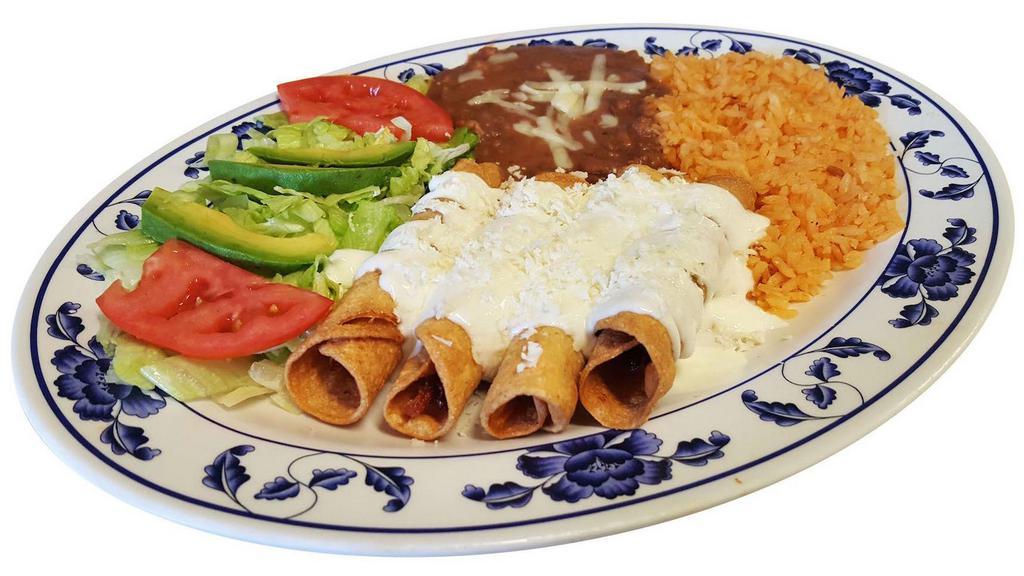 Flautas · Fried chicken taquitos(4) topped with cheese and sour cream. Served with refried beans,rice and salad on the side.
