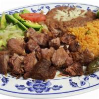 Orden de Carnitas · Fried pork tender meat served with grilled onions and jalapeno, refried beans,rice, salad an...