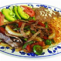 Beef Fajita · Steak pieces, bell pepper,tomate,anions.Served with refried beans,rice and salad on the side