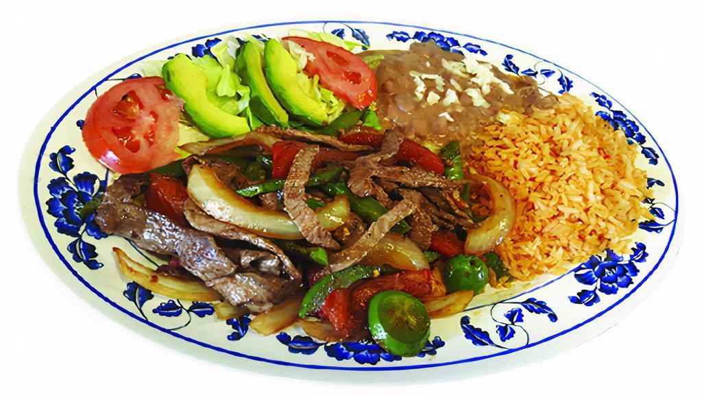 Beef Fajita · Steak pieces, bell pepper,tomate,anions.Served with refried beans,rice and salad on the side