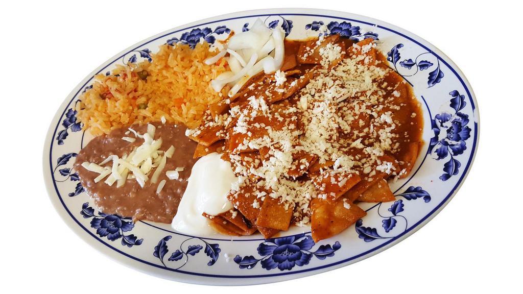 Chilaquiles Rojos(Red) · Fried corn tortilla pieces simmered with our special spicy red sauce topped with  cotija cheese ,sour cream and fresh onions