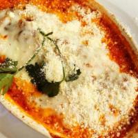 Lasagna Rustica · Lasagna filled with mushrooms, ground sausage and ricotta cheese in tomato sauce, topped wit...